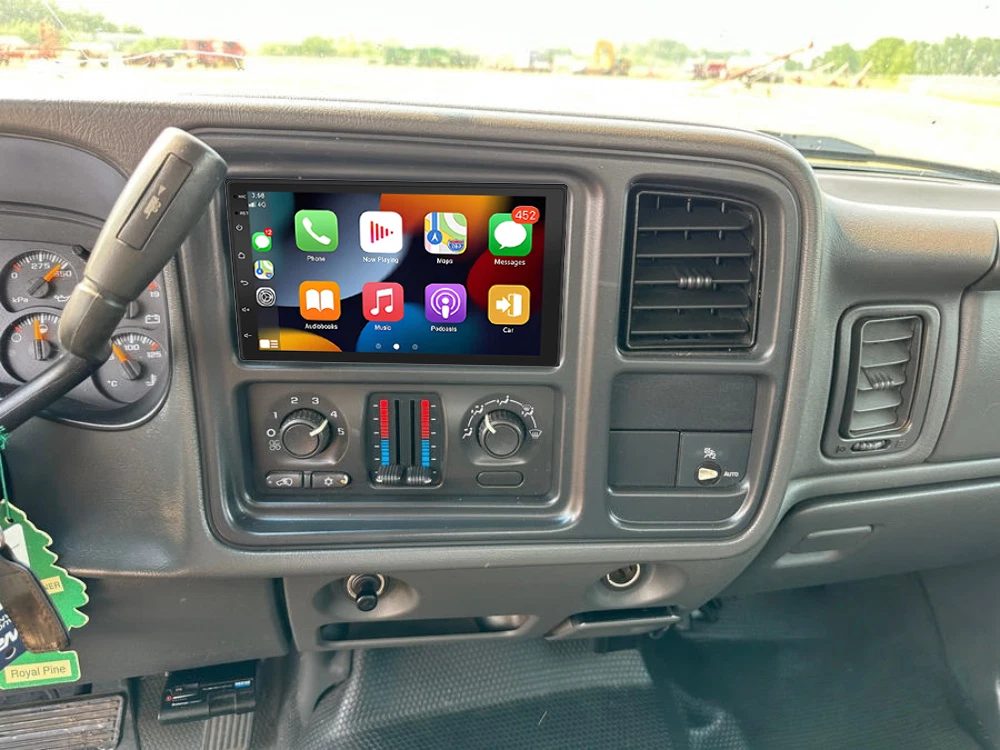Aftermarket touchscreen stereo installed in a pickup dash