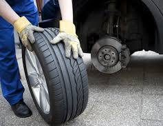 Technician changing a tire at the roadside
